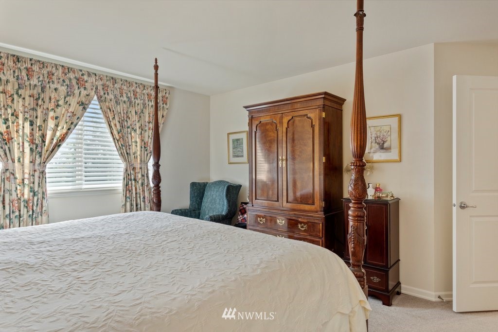 2013 Northeast 15th Street Renton, WA 98056 - Photo 17 of 29 a bedroom with a bed and a mirror