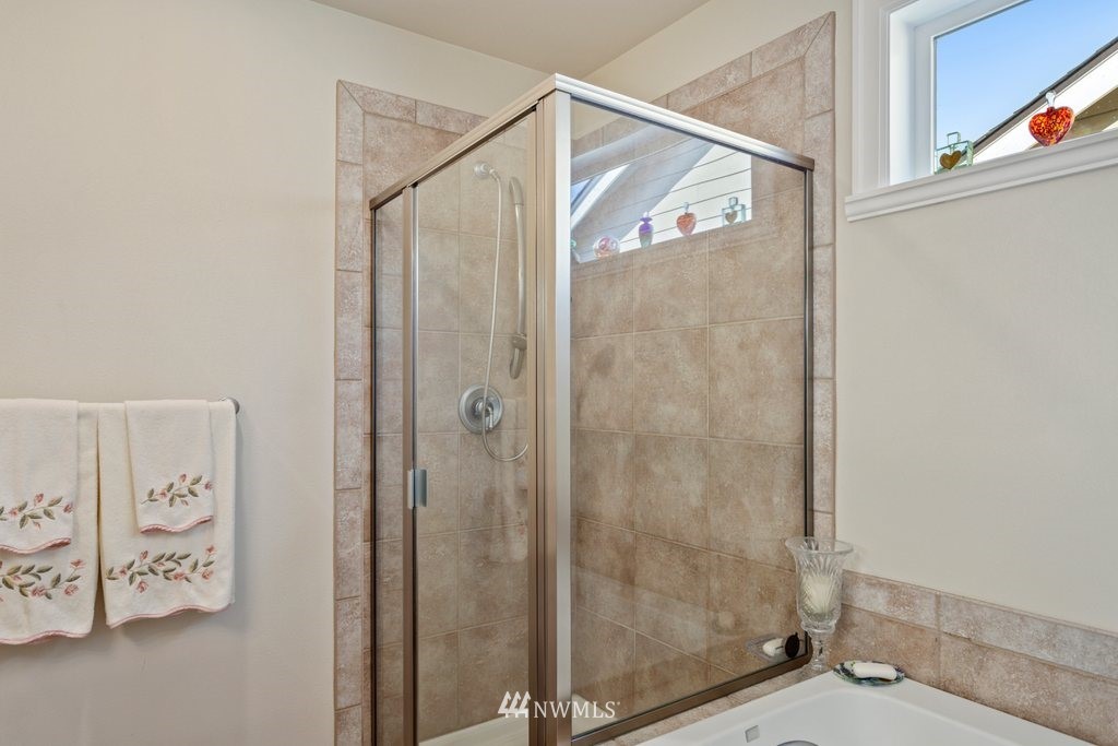 2013 Northeast 15th Street Renton, WA 98056 - Photo 21 of 29 a bathroom with a bathtub and a window