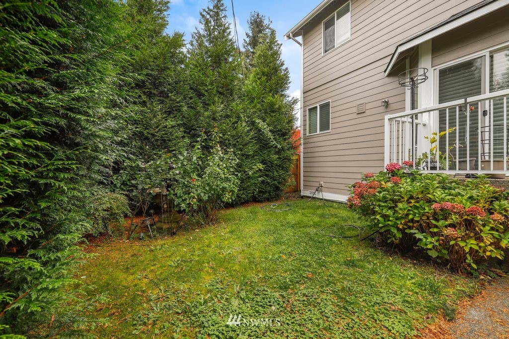 2013 Northeast 15th Street Renton, WA 98056 - Photo 26 of 29 a view of a backyard with plants and large trees