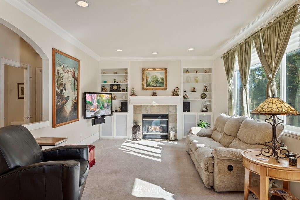 2013 Northeast 15th Street Renton, WA 98056 - Photo 5 of 29 a living room with furniture and a fireplace