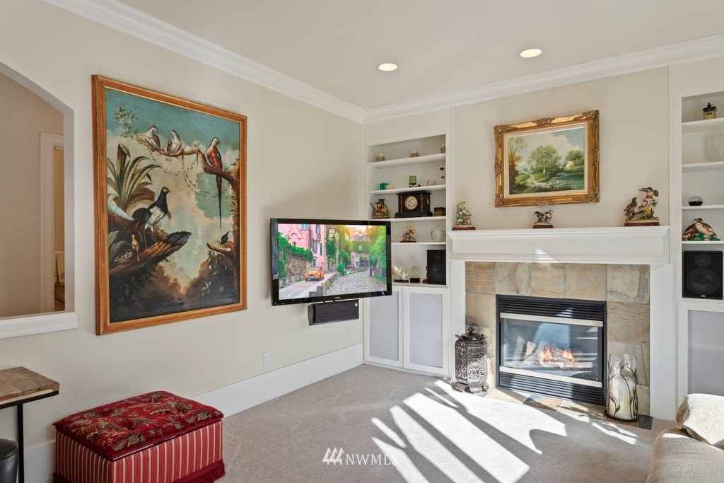 2013 Northeast 15th Street Renton, WA 98056 - Photo 6 of 29 a view of a dining room with furniture a chandelier windows and wooden floor