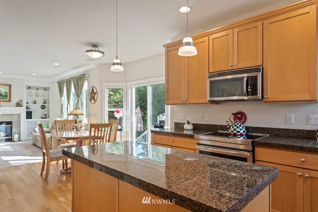 2013 Northeast 15th Street Renton, WA 98056 - Photo 9 of 29 a kitchen with a refrigerator and cabinets
