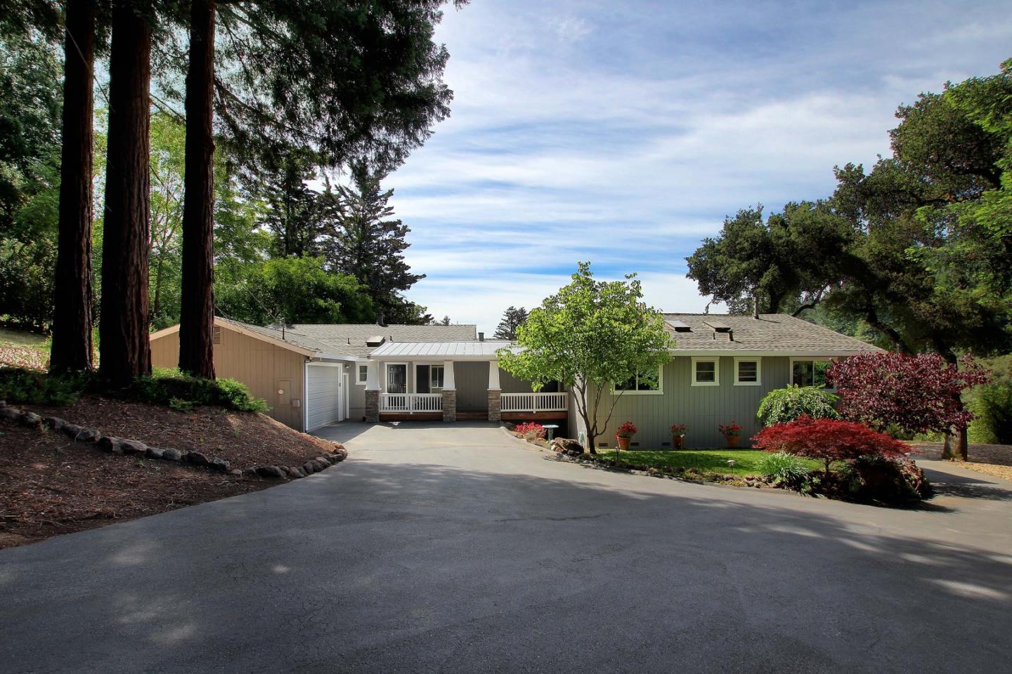 1595 River Road Brookdale, CA 95005 - Photo 1 of 50 a view of a house with potted plants and large trees