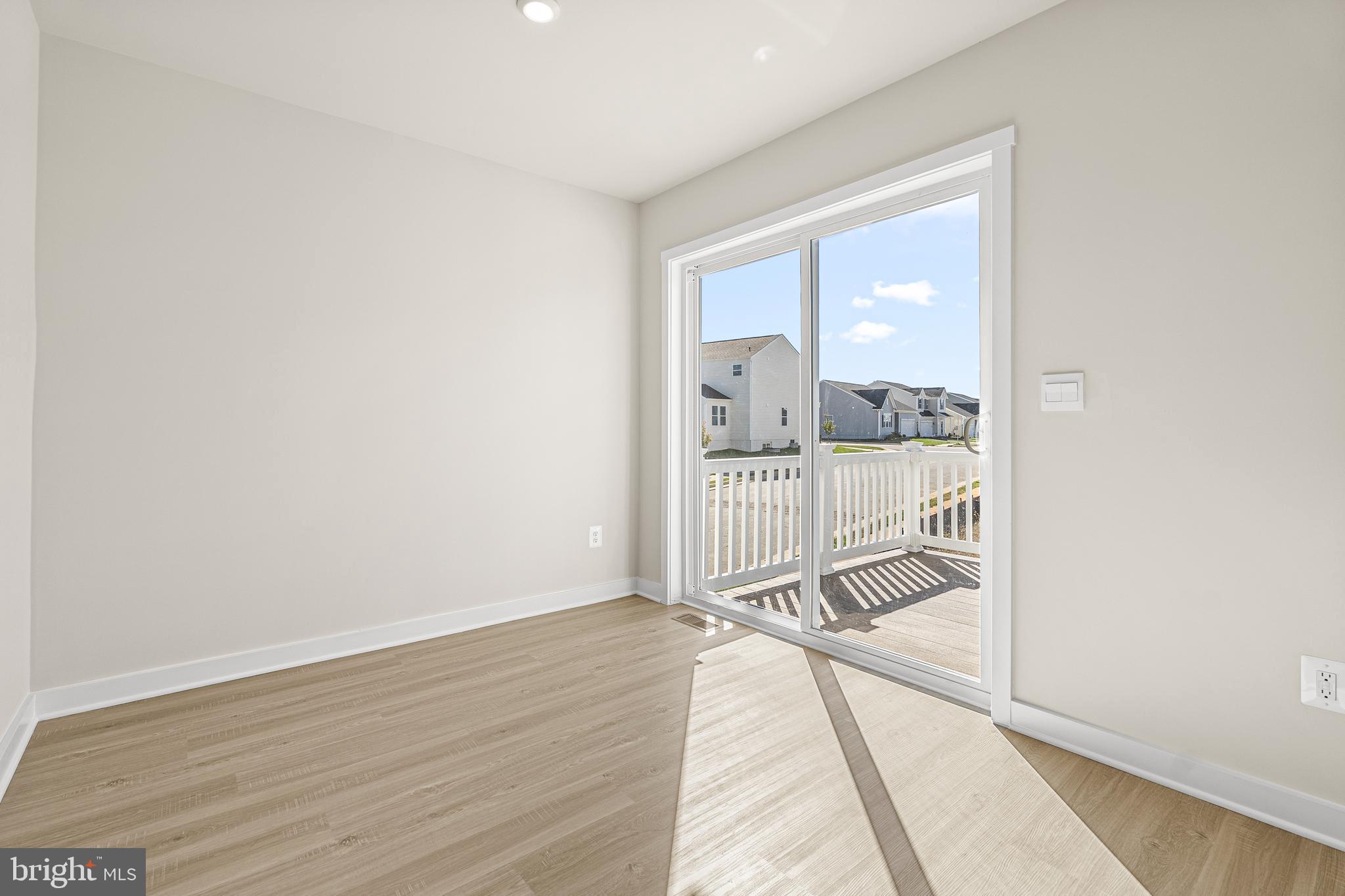 177 Huntwell W Avenue Ranson, WV 25438 - Photo 8 of 20 wooden floor with a bedroom