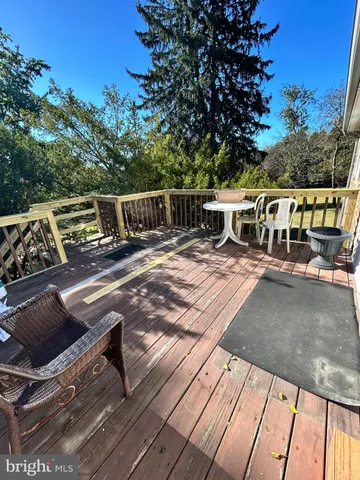 a view of a patio with wooden floor
