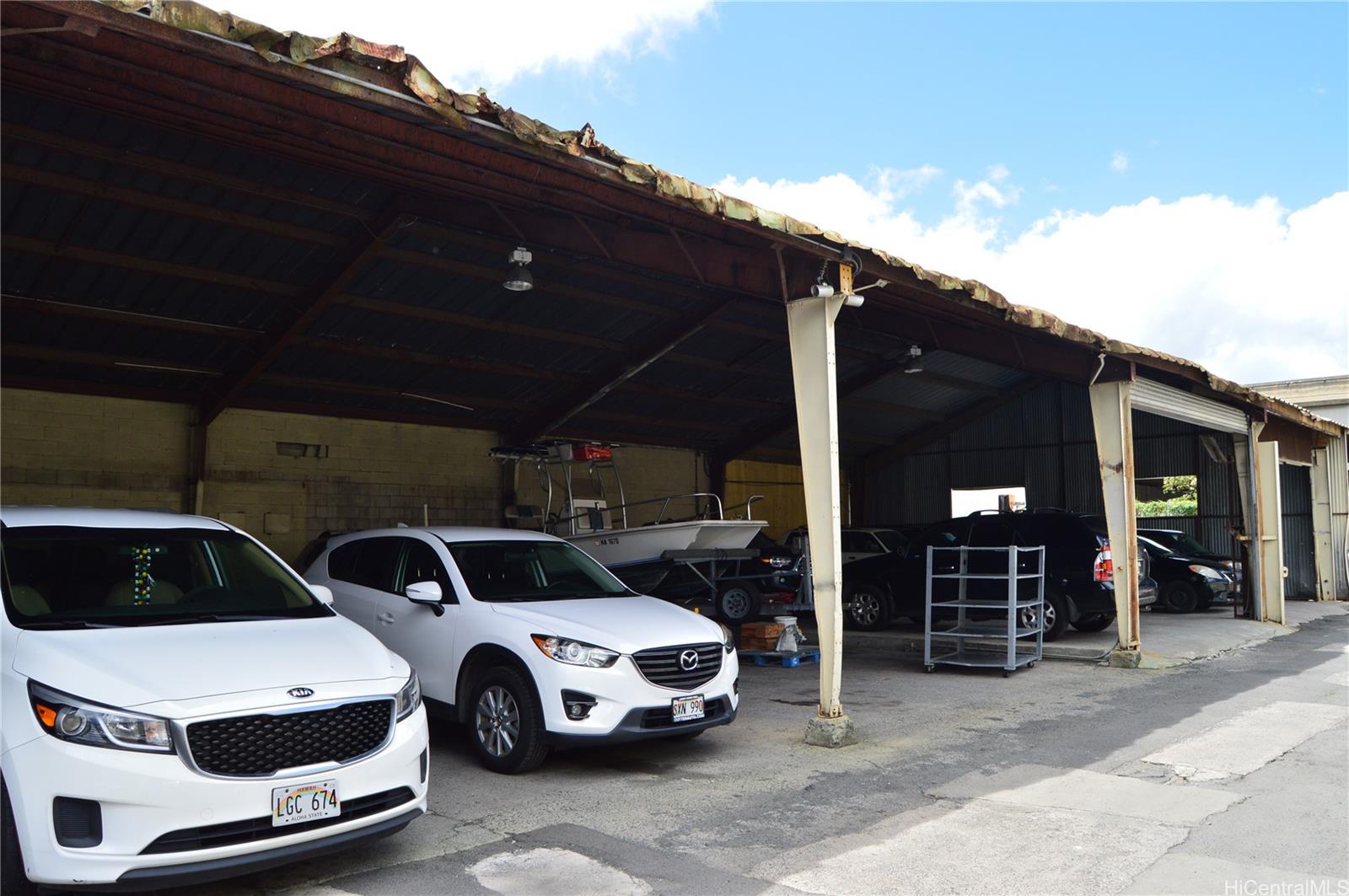 2726 Waiwai Loop Honolulu, HI 96819 - Photo 10 of 17 a front view of a house with parking space