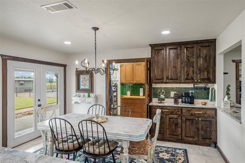 733 Rains County Road 1430 Point, TX 75472 - Photo 13 of 40 a living room with furniture a large window and a table