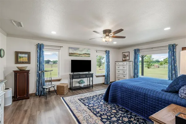a living room with a couch a rug and a flat screen tv