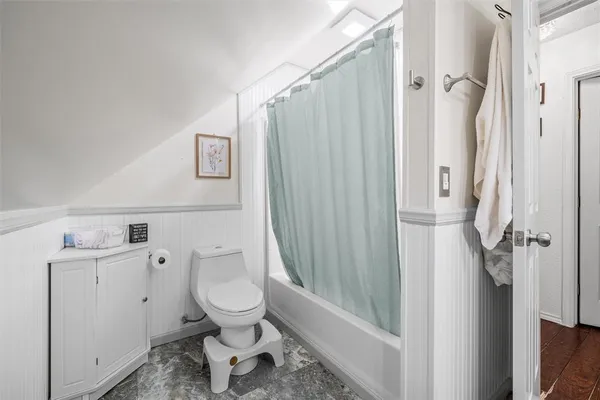 a bathroom with a toilet sink and a shower