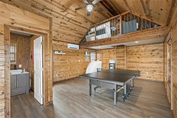a view of a room with wooden floor and windows