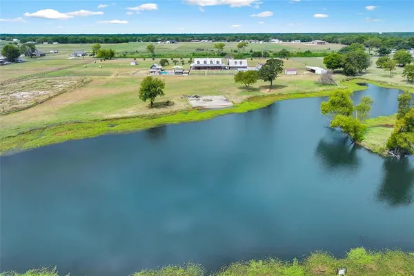 a view of a lake with a big yard