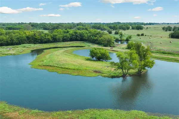 a view of a lake with a yard