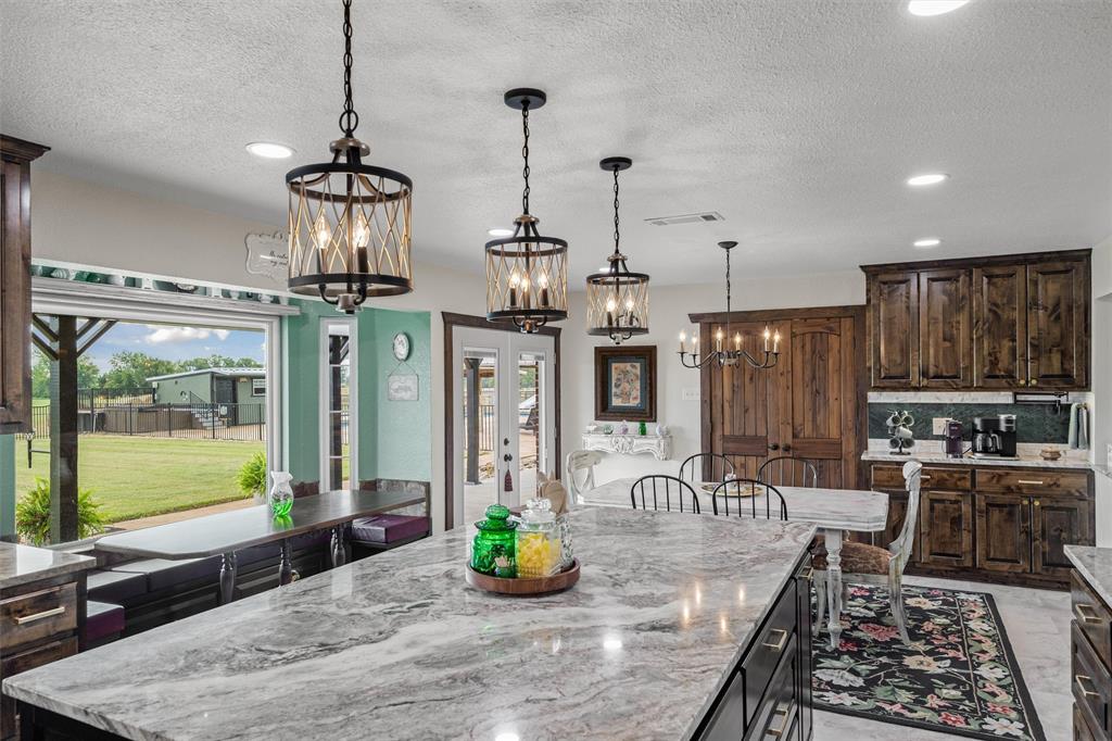 733 Rains County Road 1430 Point, TX 75472 - Photo 10 of 40 a kitchen with stainless steel appliances granite countertop a sink a stove and a wooden floors