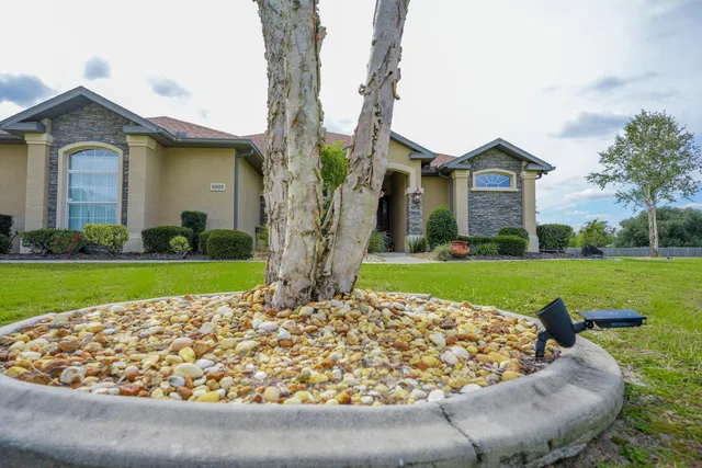 hallway view with wooden floor and dining room