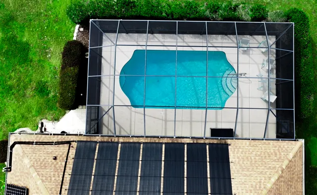 a living room with furniture a window and gym equipment