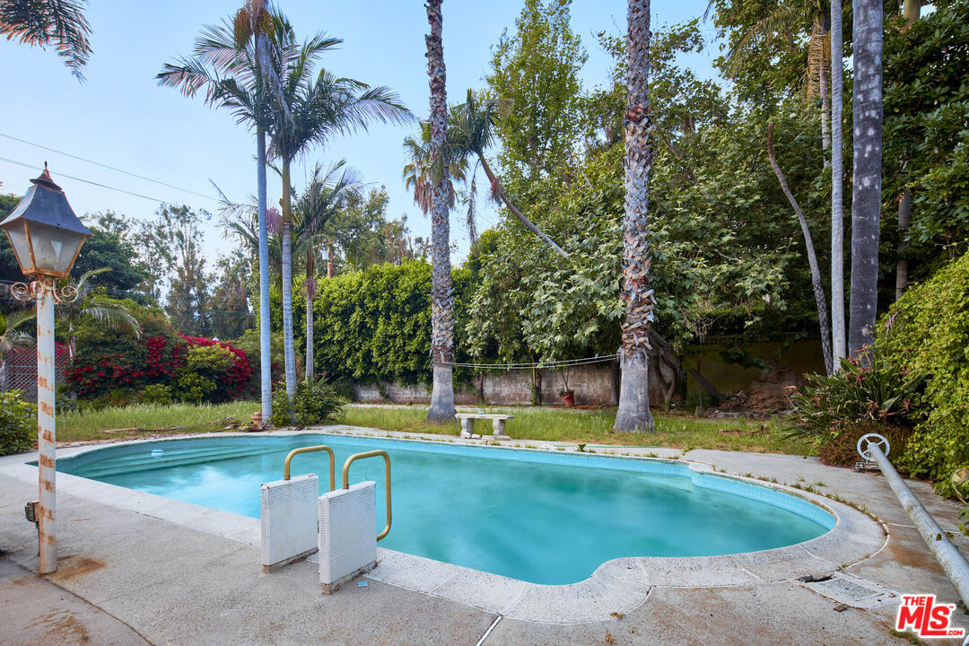 6414 Bonsall Drive Malibu, CA 90265 - Photo 17 of 75 a view of a swimming pool with a patio