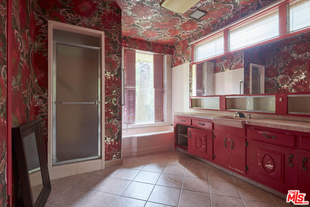 6414 Bonsall Drive Malibu, CA 90265 - Photo 33 of 75 a bathroom with a granite countertop sink and a mirror