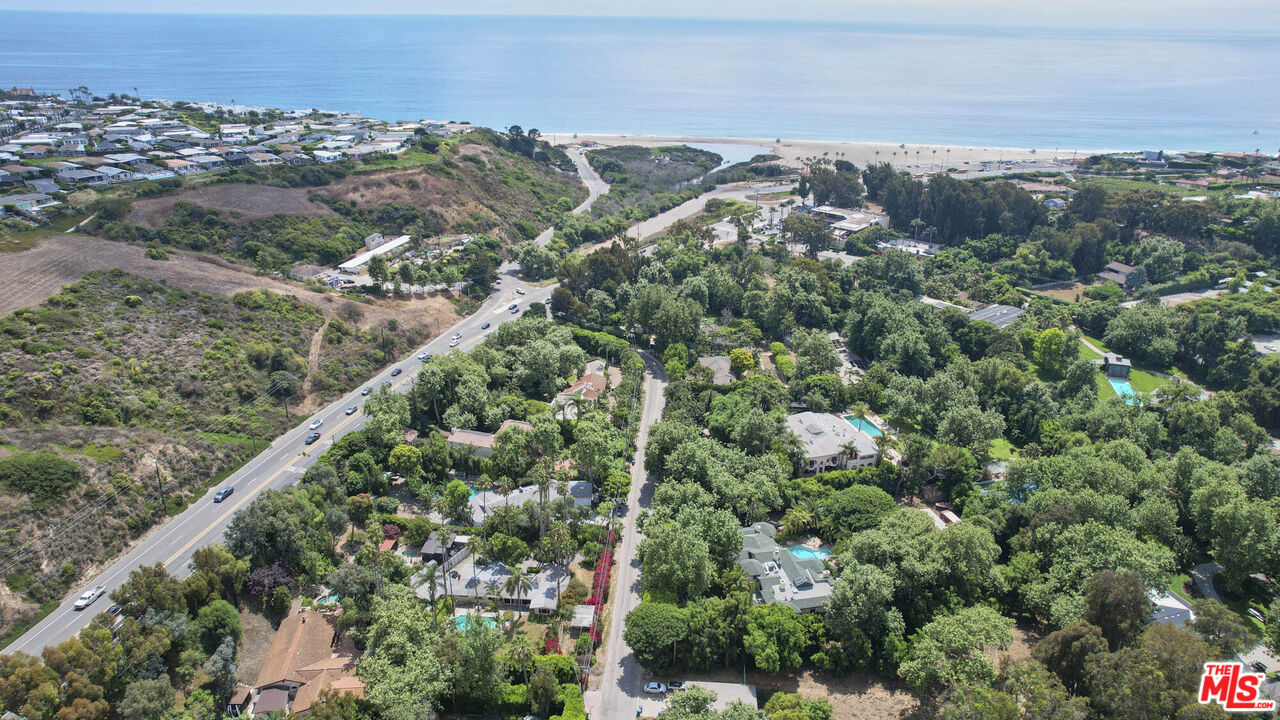 6414 Bonsall Drive Malibu, CA 90265 - Photo 46 of 75 an aerial view of a houses with a lush green hillside
