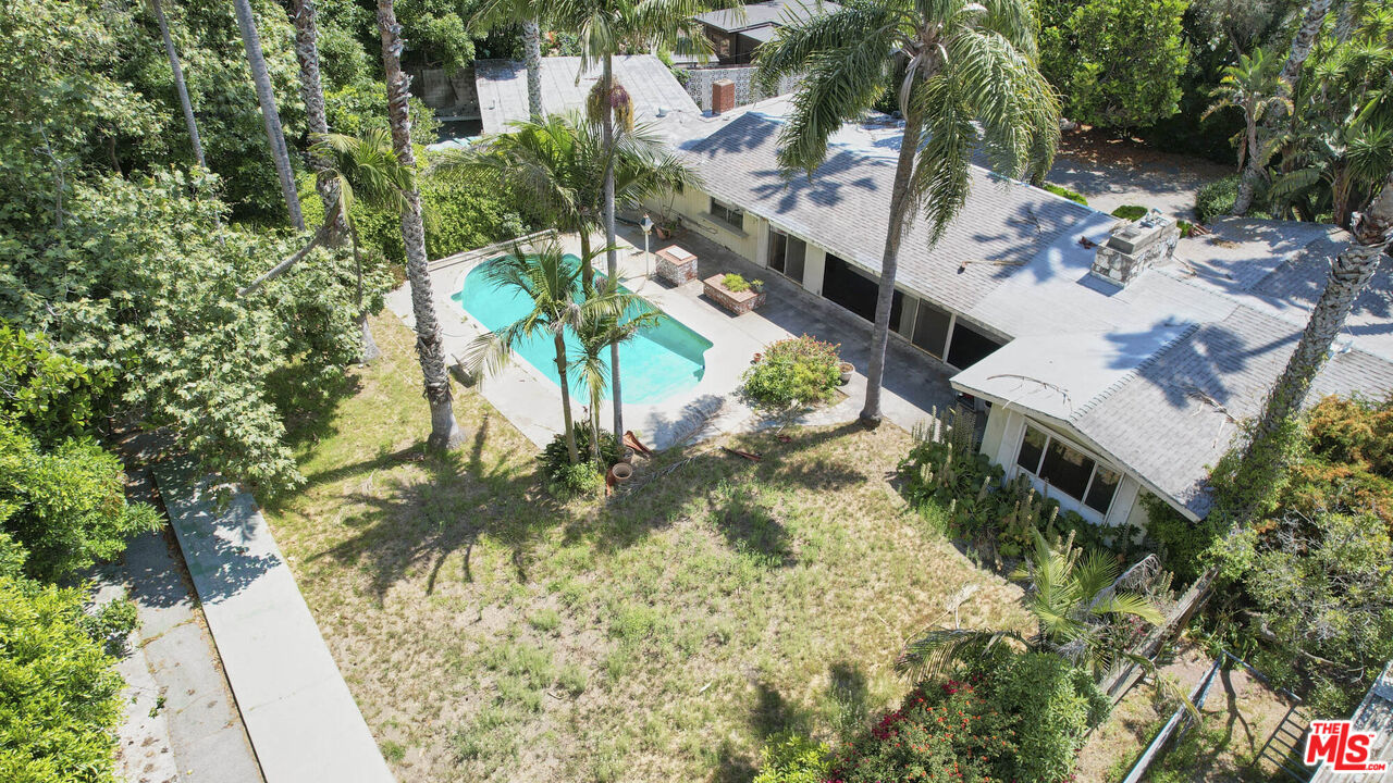 6414 Bonsall Drive Malibu, CA 90265 - Photo 53 of 75 a view of swimming pool with lawn chairs and plants
