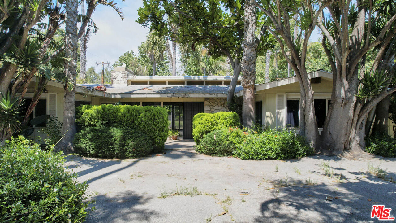 6414 Bonsall Drive Malibu, CA 90265 - Photo 62 of 75 a front view of a house with garden