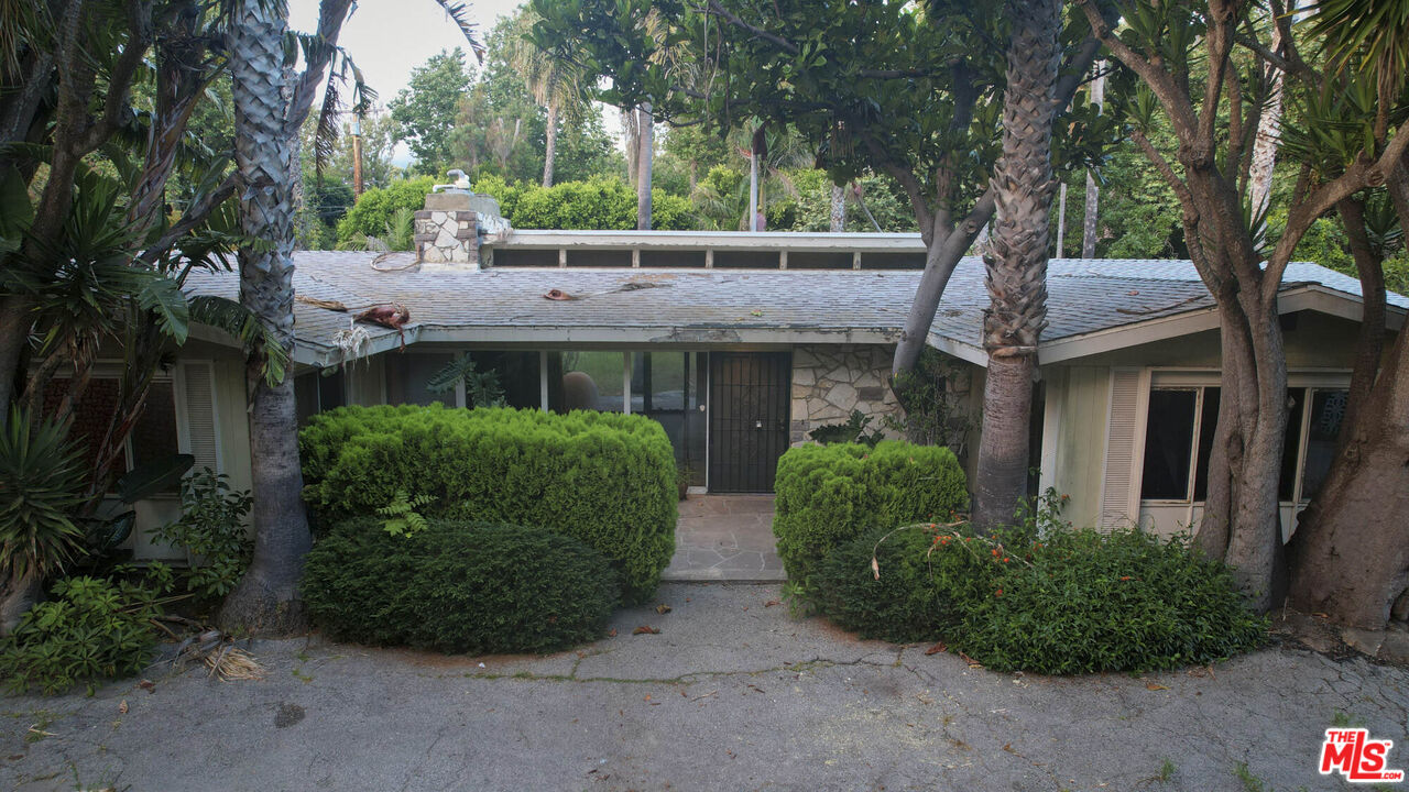 6414 Bonsall Drive Malibu, CA 90265 - Photo 72 of 75 a front view of a house with garden