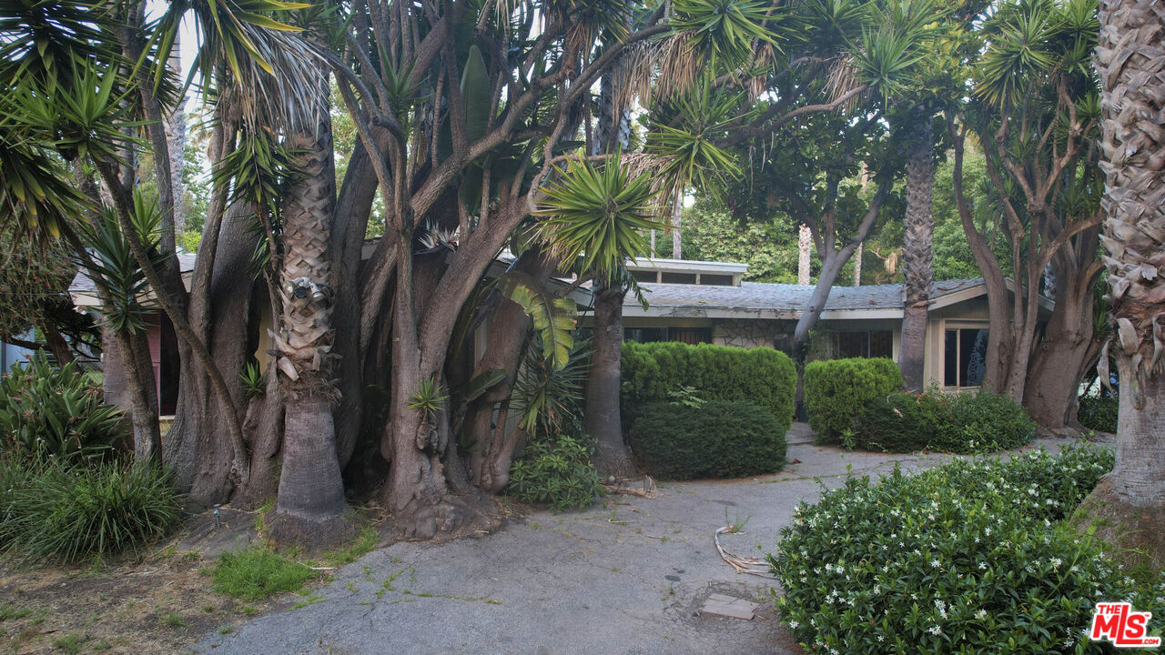 6414 Bonsall Drive Malibu, CA 90265 - Photo 73 of 75 a front view of a house with a garden