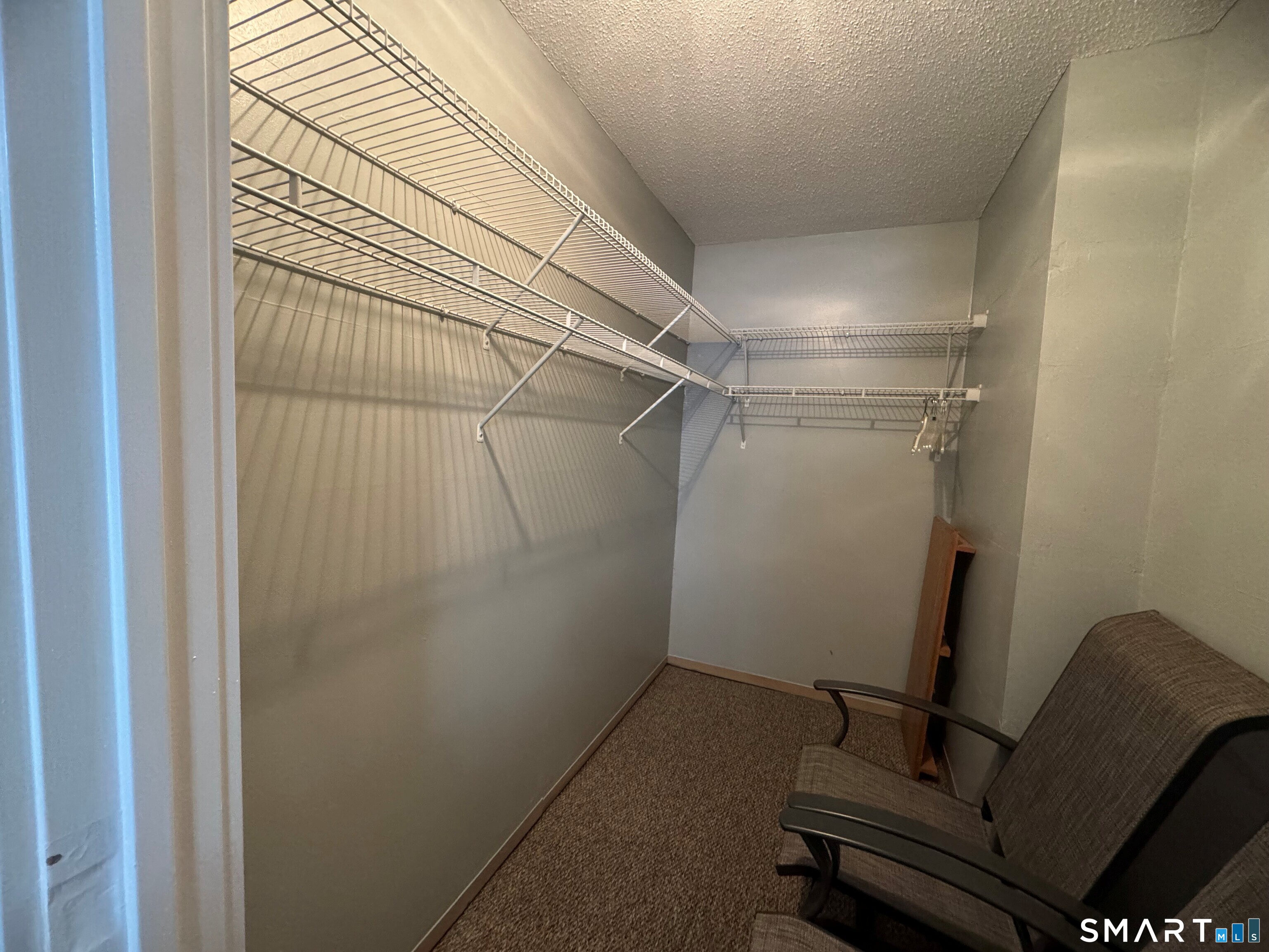 357 East Mitchell Avenue, Unit 357 Cheshire, CT 06410 - Photo 11 of 19 Large walk-in closet in primary bedroom