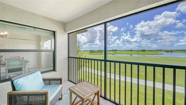 a balcony with furniture and wooden floor