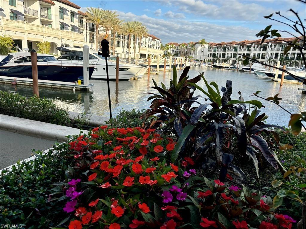 1435 Curlew Avenue, Unit 3 Naples, FL 34102 - Photo 25 of 28 a picture of flowers in front of building