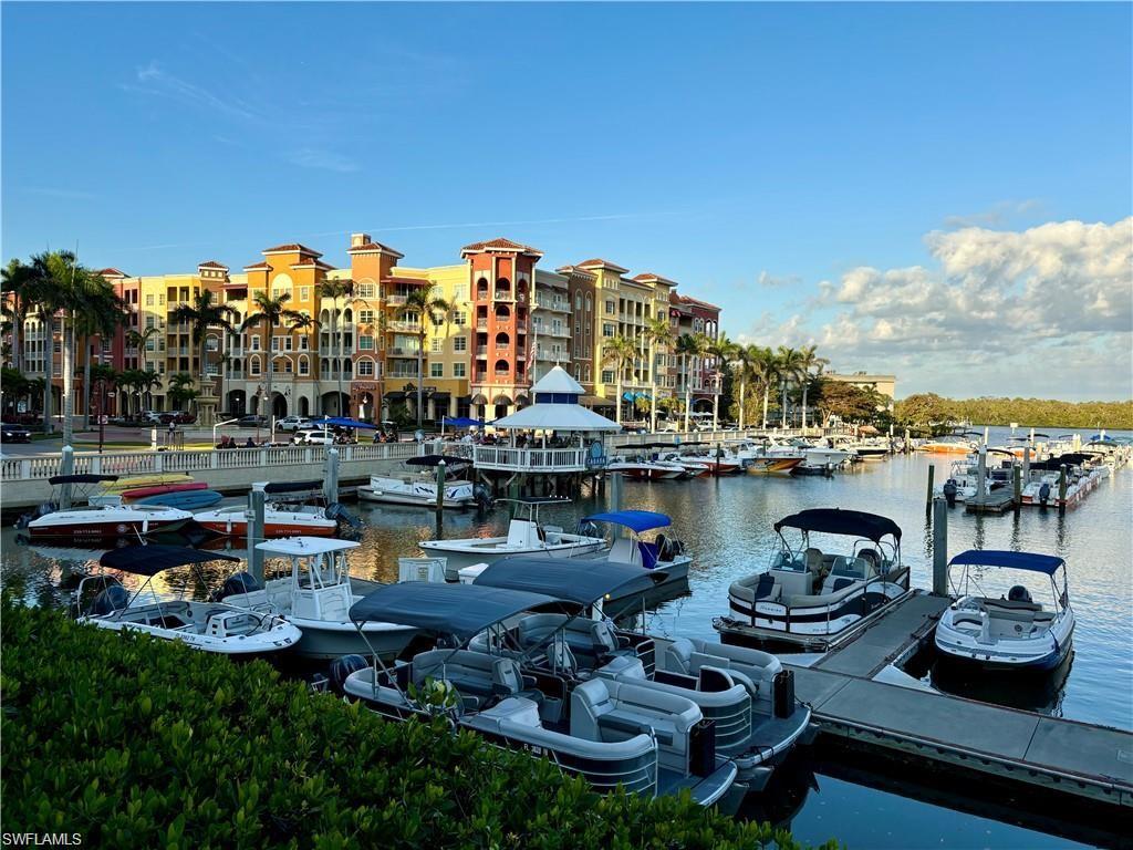 1435 Curlew Avenue, Unit 3 Naples, FL 34102 - Photo 26 of 28 a view of a lake with couches and chairs