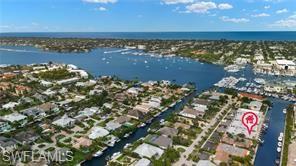 1435 Curlew Avenue, Unit 3 Naples, FL 34102 - Photo 27 of 28 view of a lake