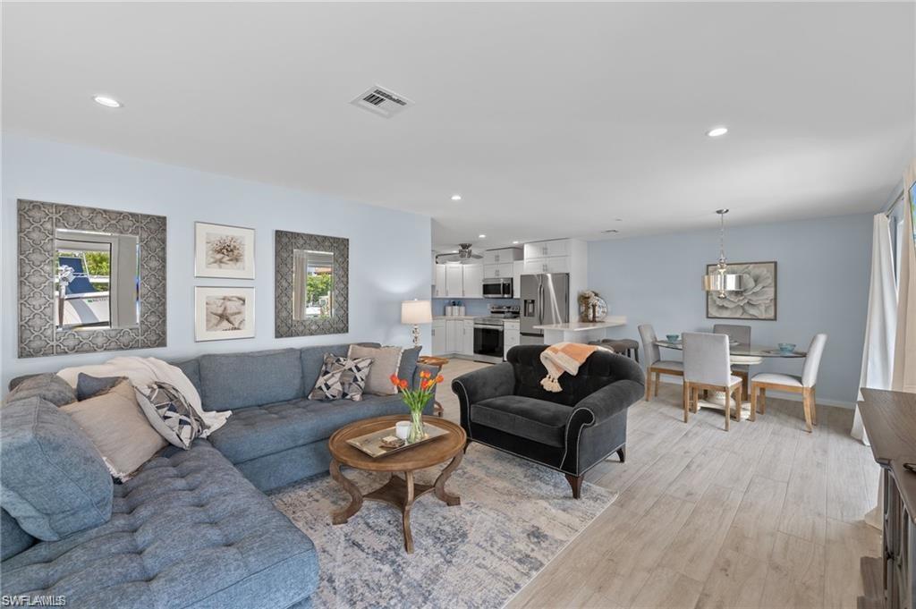 1435 Curlew Avenue, Unit 3 Naples, FL 34102 - Photo 3 of 28 a living room with furniture and a table