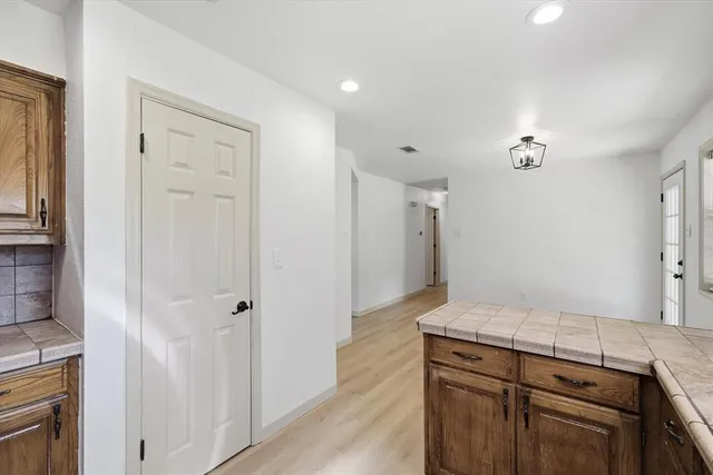a view of hallway with wooden floor