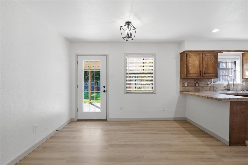 3360 Fm 1805 Van, TX 75790 - Photo 10 of 40 a view of kitchen and window with wooden floor
