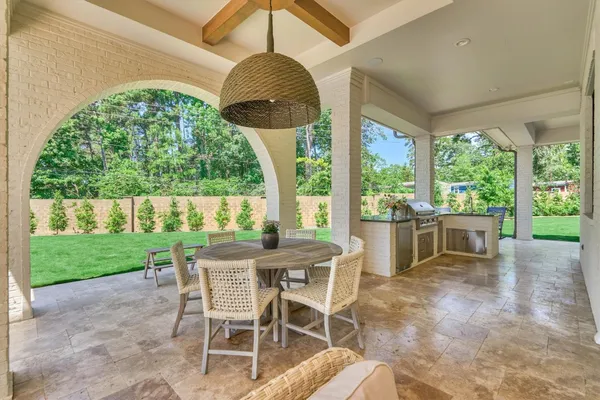 a kitchen with a stove and a large window