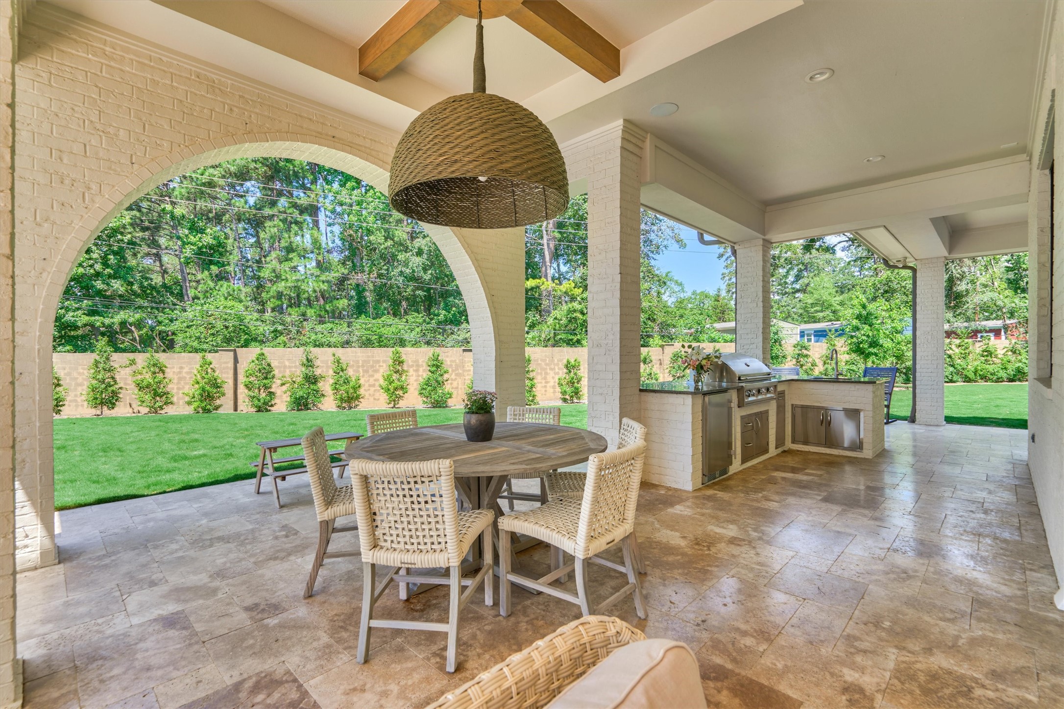 7715 Morgans Pond Court Spring, TX 77389 - Photo 41 of 50 Outdoor dining near arched opening to large green space. Enjoy dinner with family and friends.