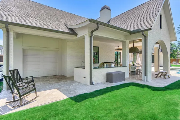 a front view of house with yard and green space
