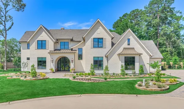 a view of outdoor space with garden and trees