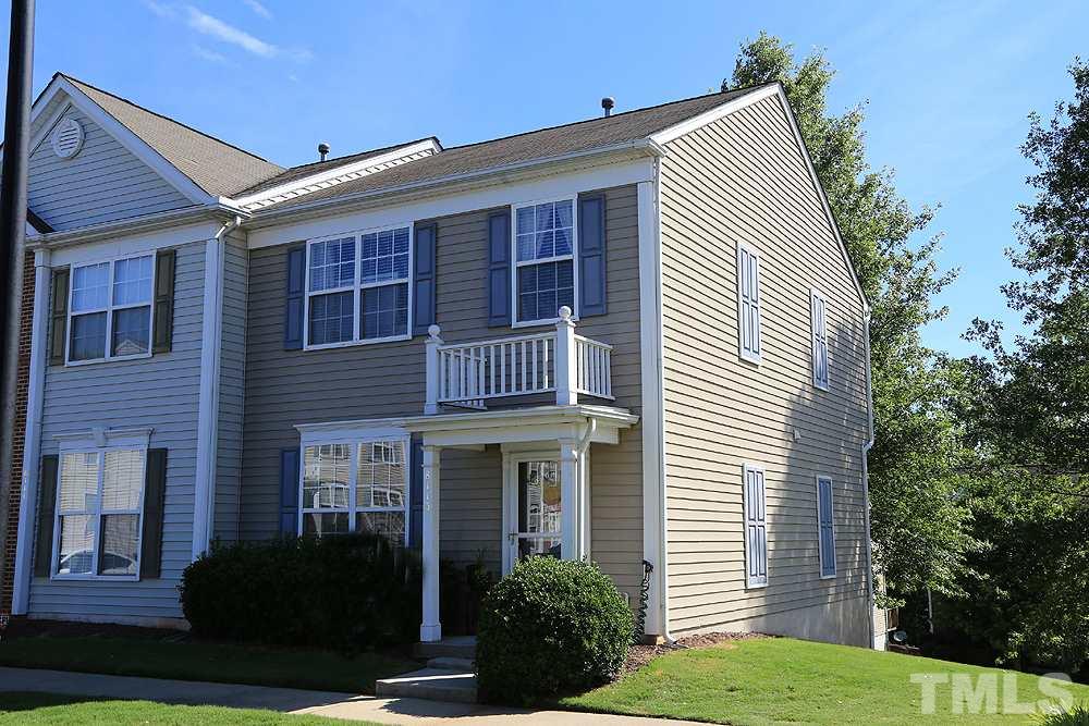 8113 Rhiannon Road Raleigh, NC 27613 - Photo 1 of 12 a front view of a house with garden