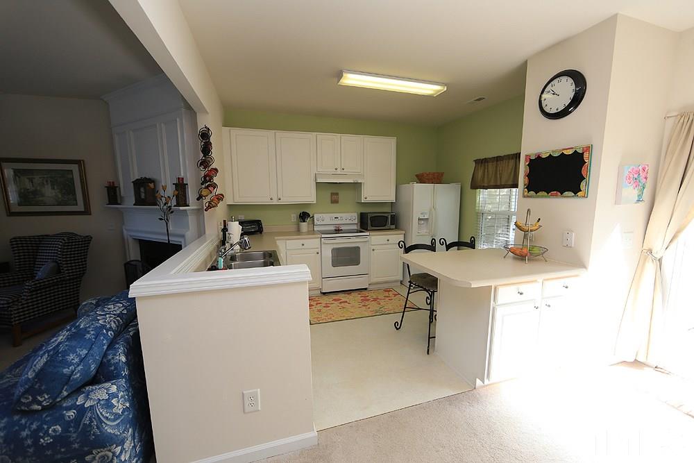 8113 Rhiannon Road Raleigh, NC 27613 - Photo 5 of 12 a view of kitchen and sink