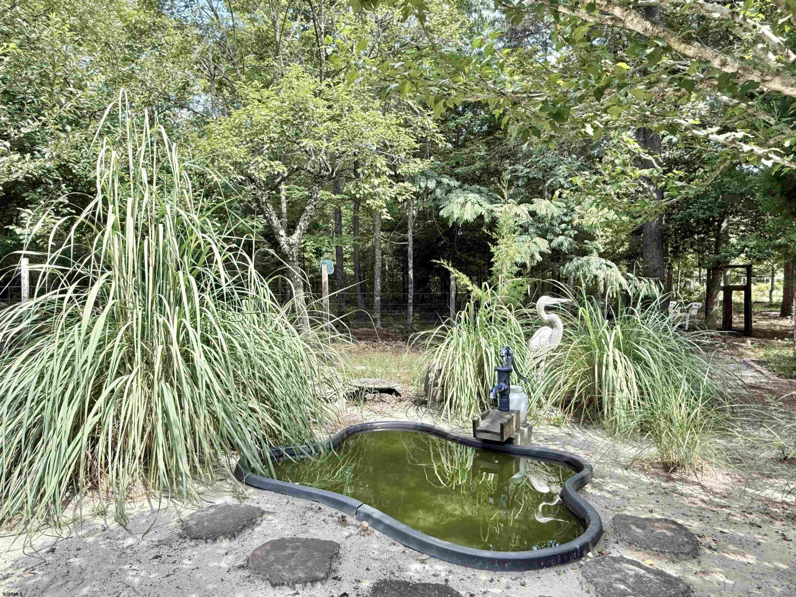 506 Hagan Road Cape May Court House, NJ 08210 - Photo 16 of 45 a vase of flowers sitting on a floor