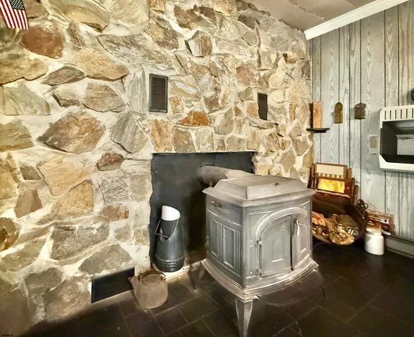 a stove top oven sitting inside of a kitchen