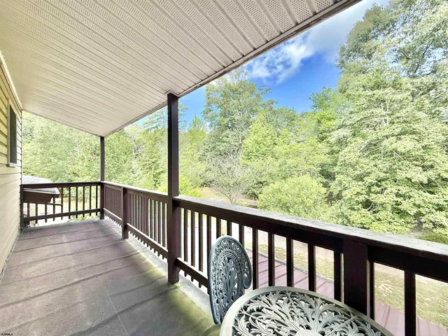 a balcony with trees