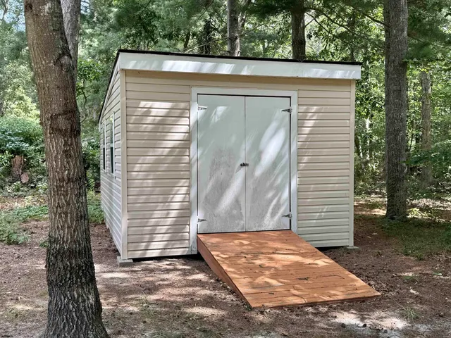 a view of a house with a small yard