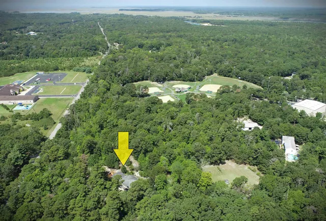 a aerial view of a house with a yard