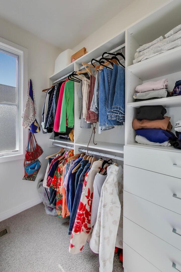 1137 West Monroe Street, Unit 9 Chicago, IL 60607 - Photo 17 of 31 a view of walk in closet with clothes and shoes