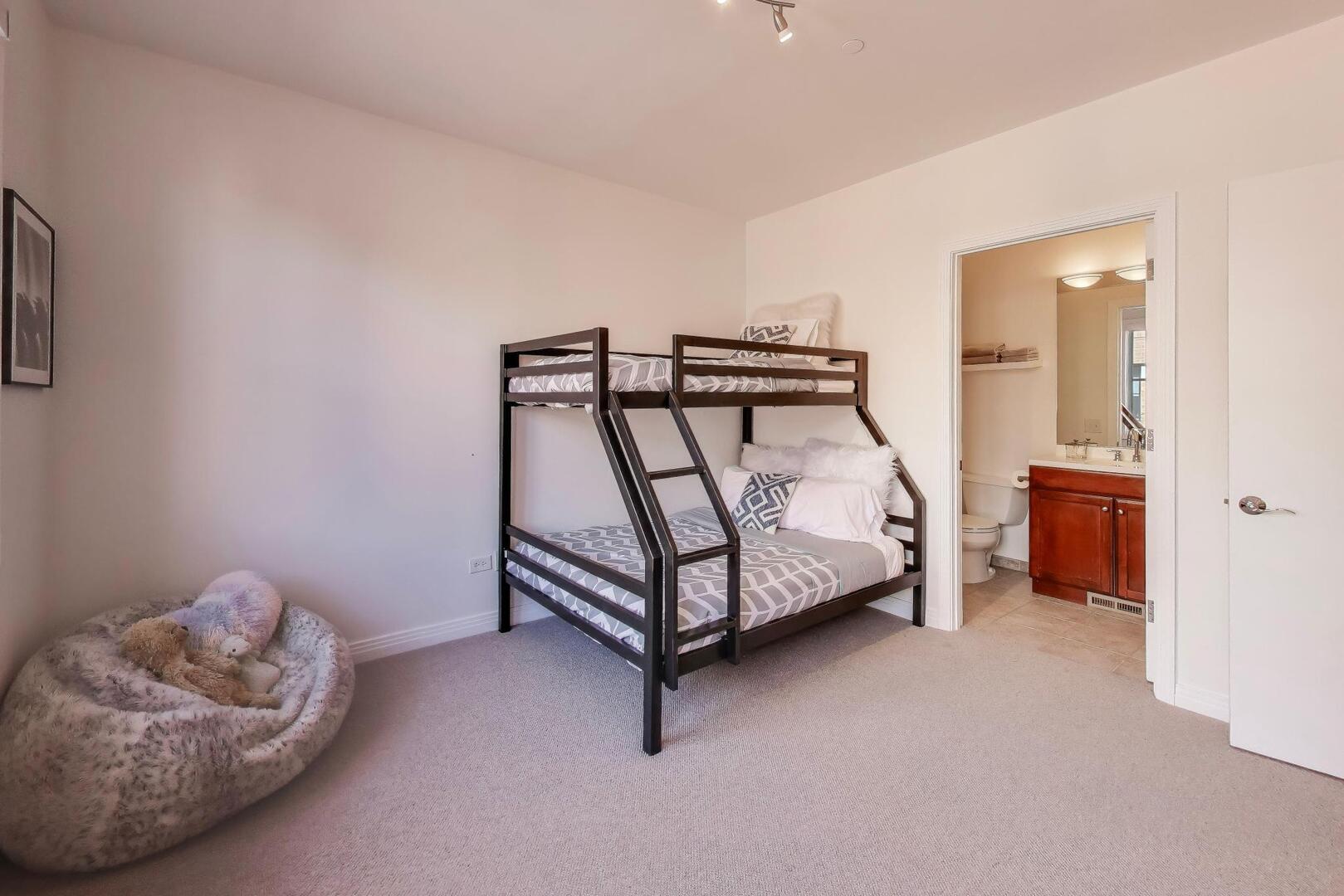 1137 West Monroe Street, Unit 9 Chicago, IL 60607 - Photo 18 of 31 a bedroom with a bed and a dresser