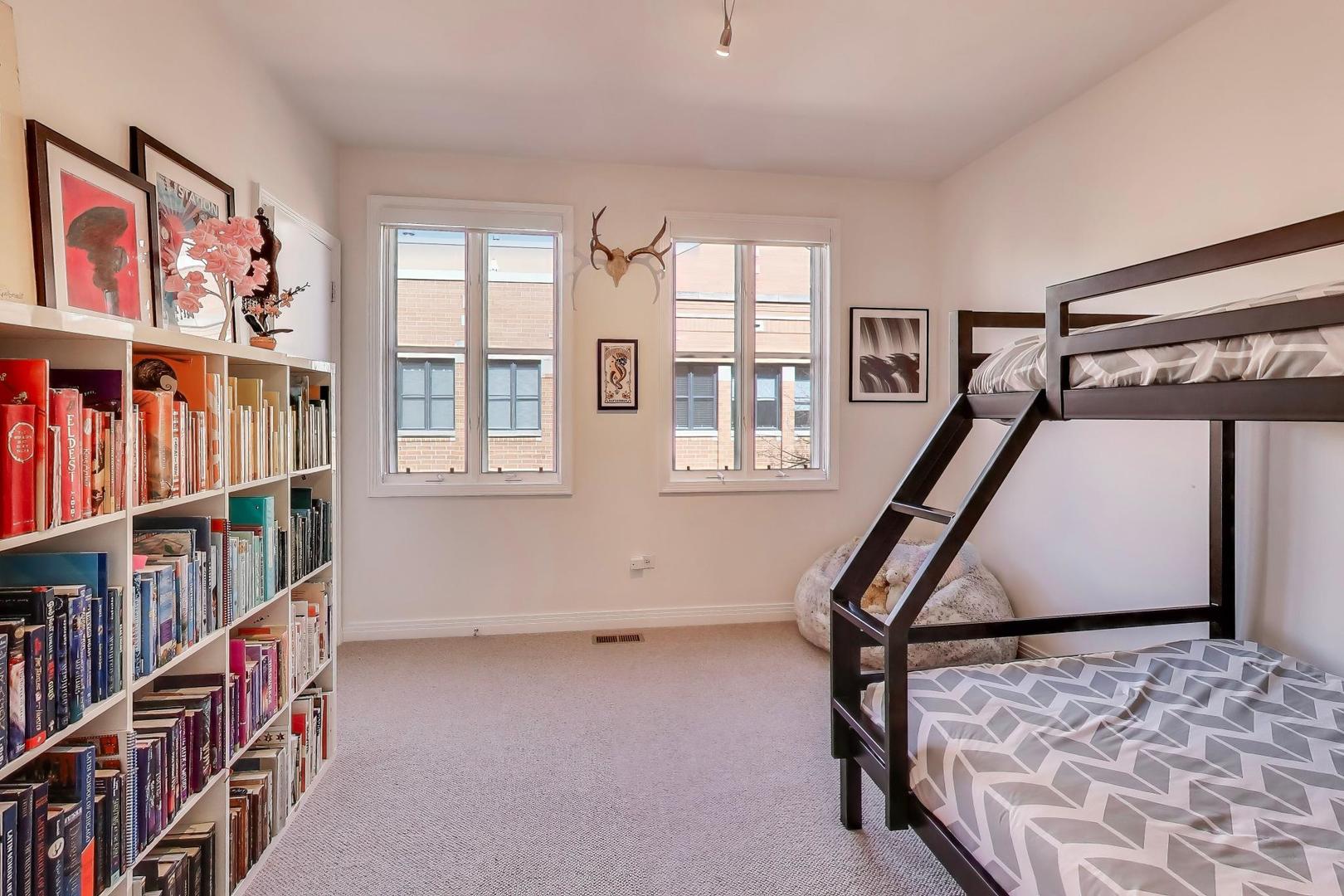 1137 West Monroe Street, Unit 9 Chicago, IL 60607 - Photo 19 of 31 a view of an empty room with windows