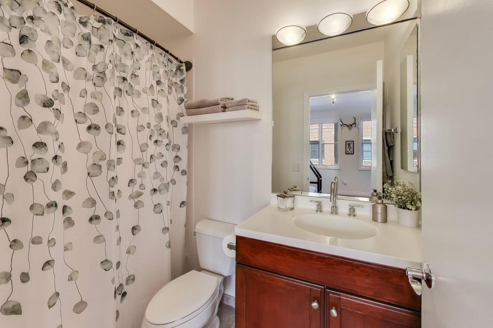 1137 West Monroe Street, Unit 9 Chicago, IL 60607 - Photo 20 of 31 a bathroom with a sink toilet and shower