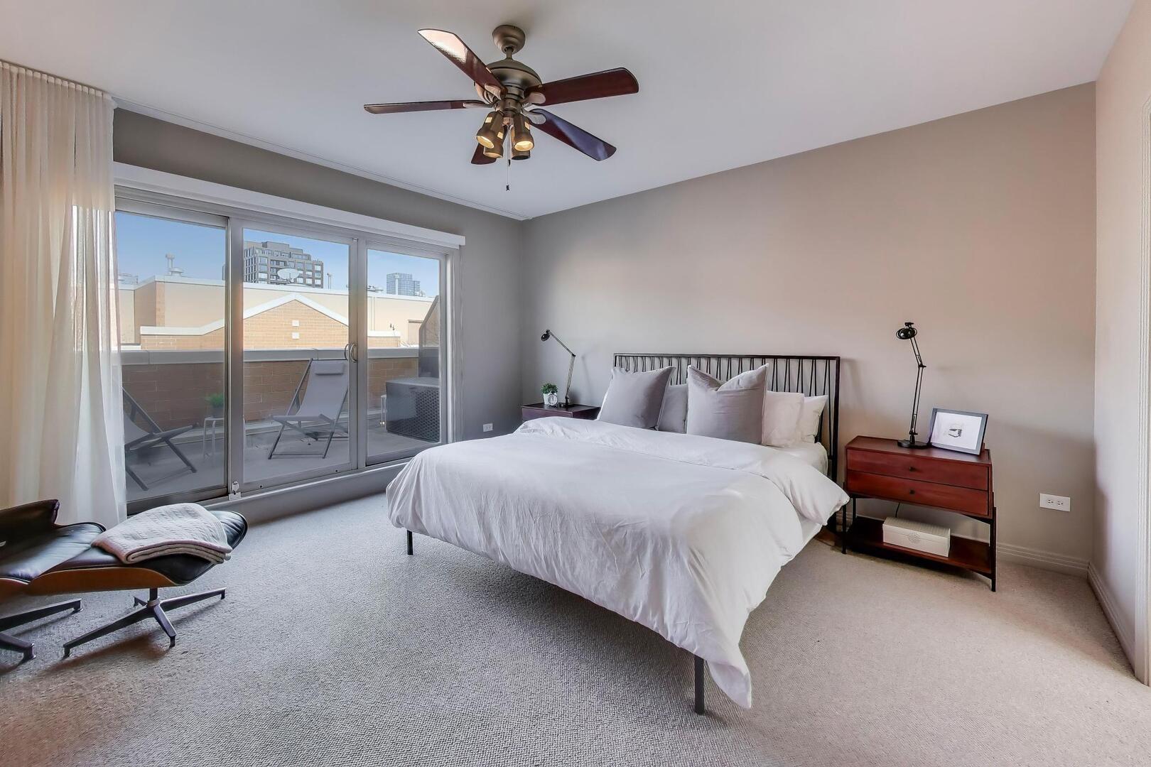 1137 West Monroe Street, Unit 9 Chicago, IL 60607 - Photo 22 of 31 a bedroom with a bed and a large window